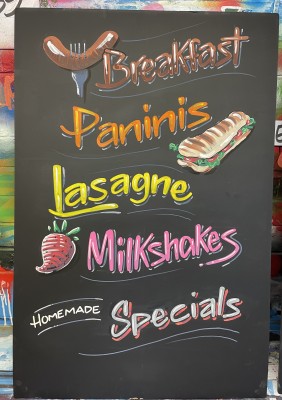 A-board painted for The Village Cafe - Street Somerset