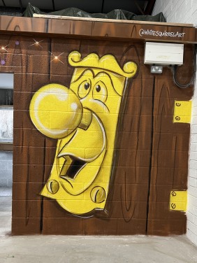 Alice in wonderland mural at Play Haven