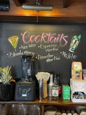 Cocktails sign created behind the bar at the Compass Tavern