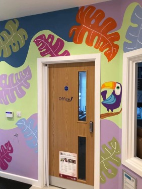 Colourful Jungle mural on reception at Nursery