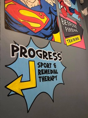 Direction sign hand painted in gym